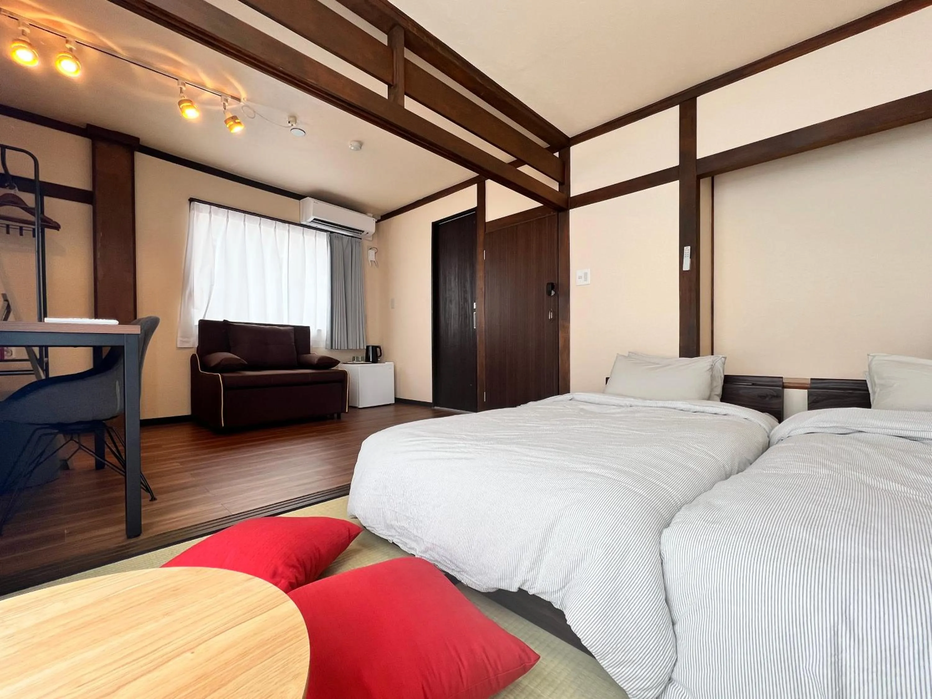 Bed in Jinya Sunset Inn by Murasaki