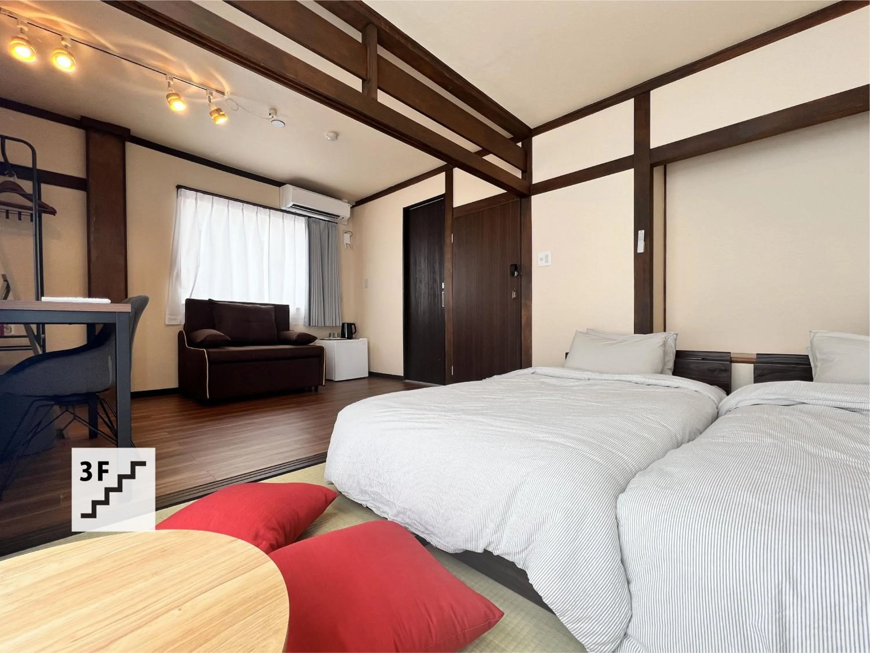 Bed in Jinya Sunset Inn by Murasaki