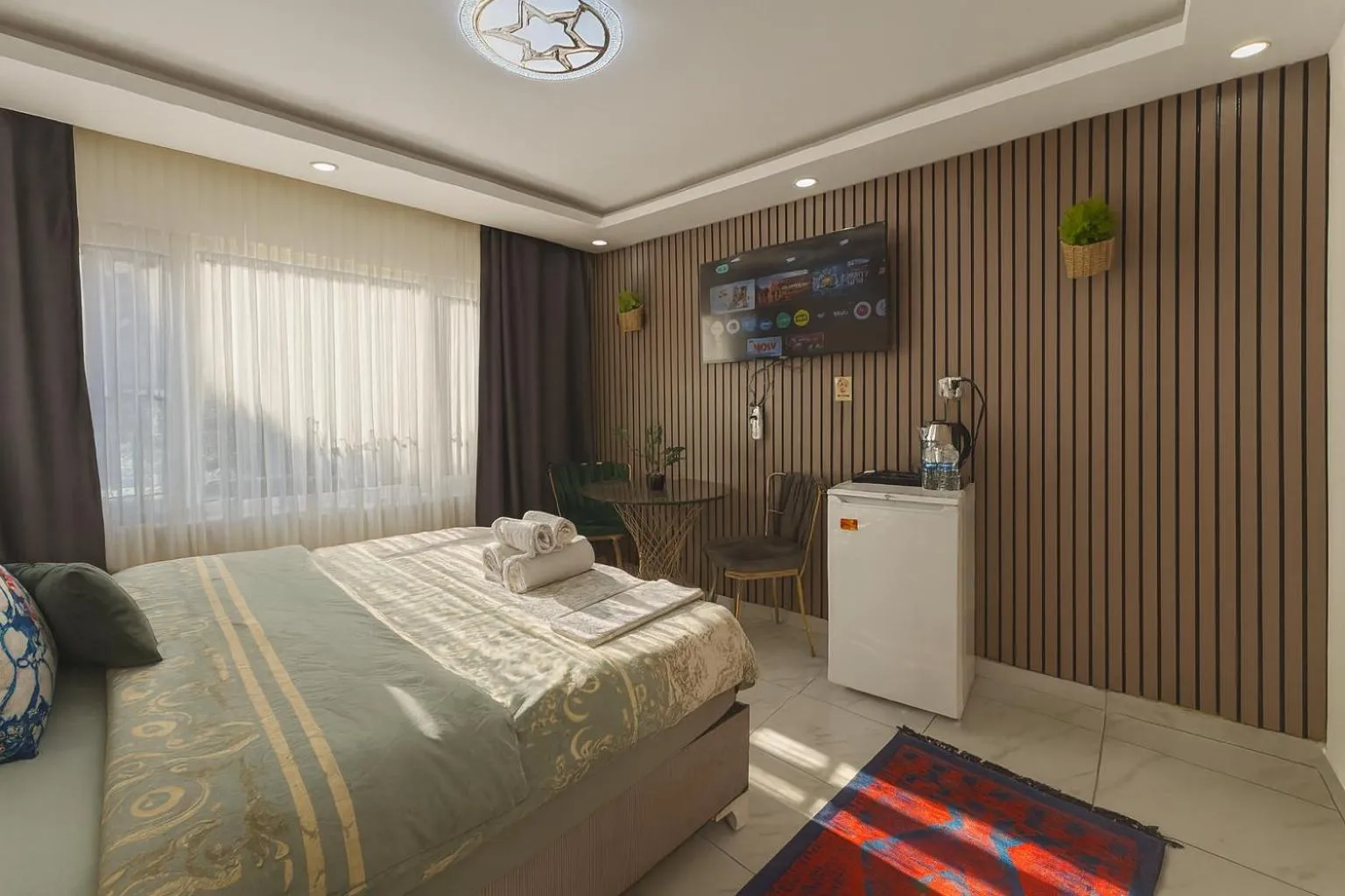 Bed in Ozer Hotel & Apartments
