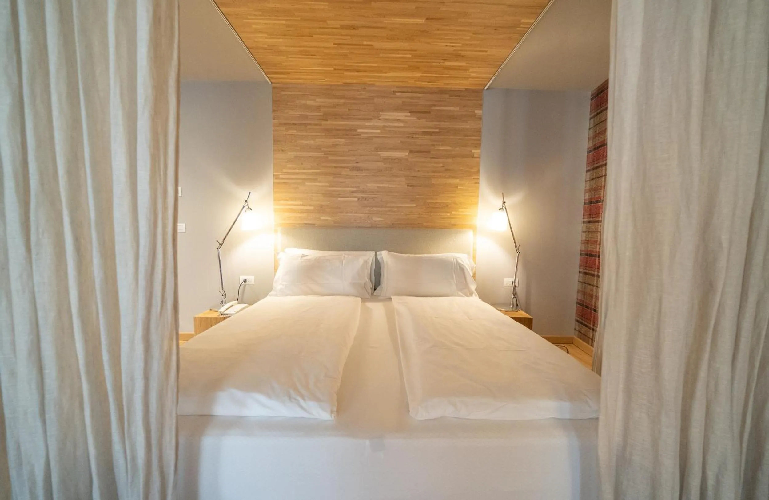 Bed in Bach Boutique Hotel