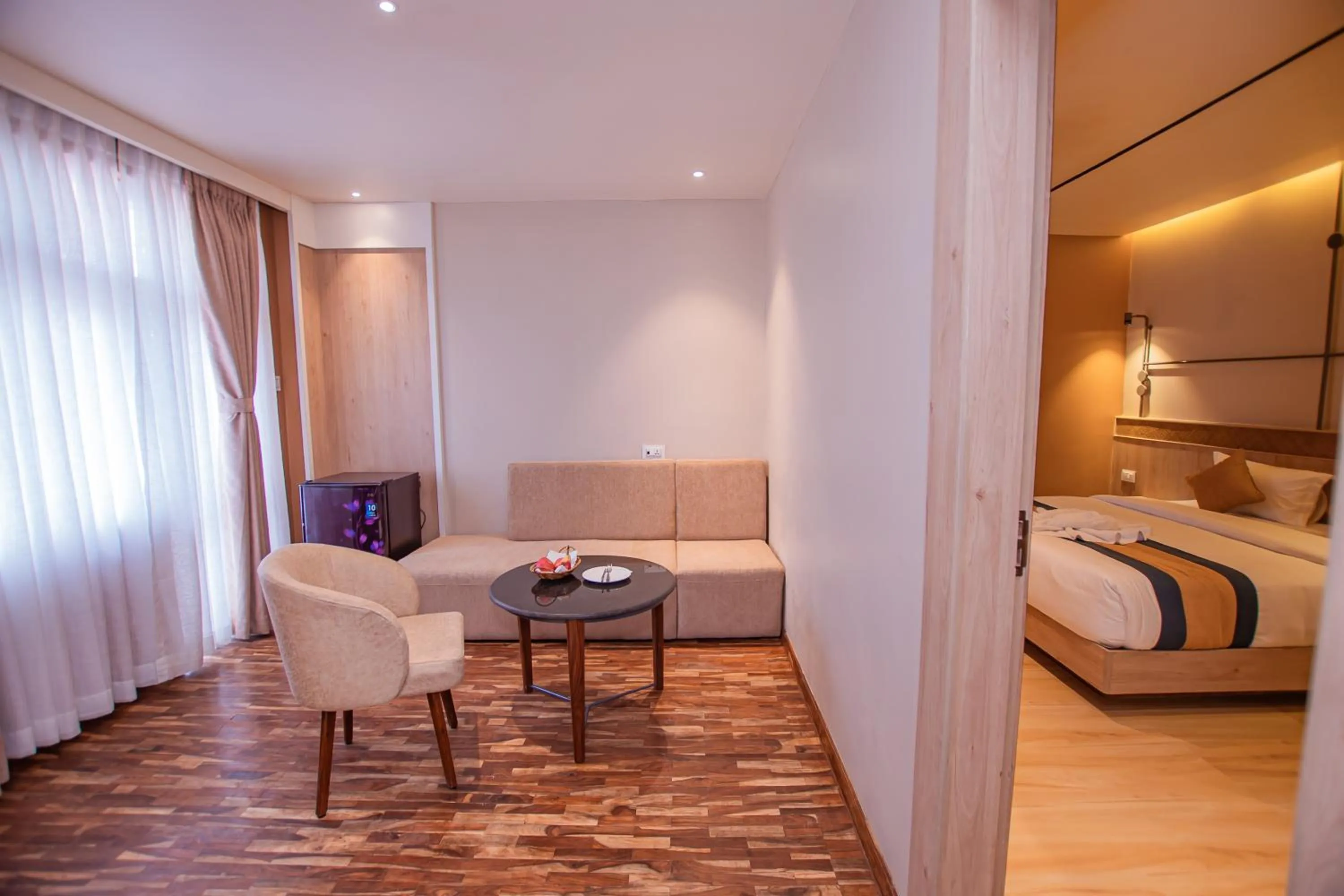 Seating area, Bed in Hotel Vistara