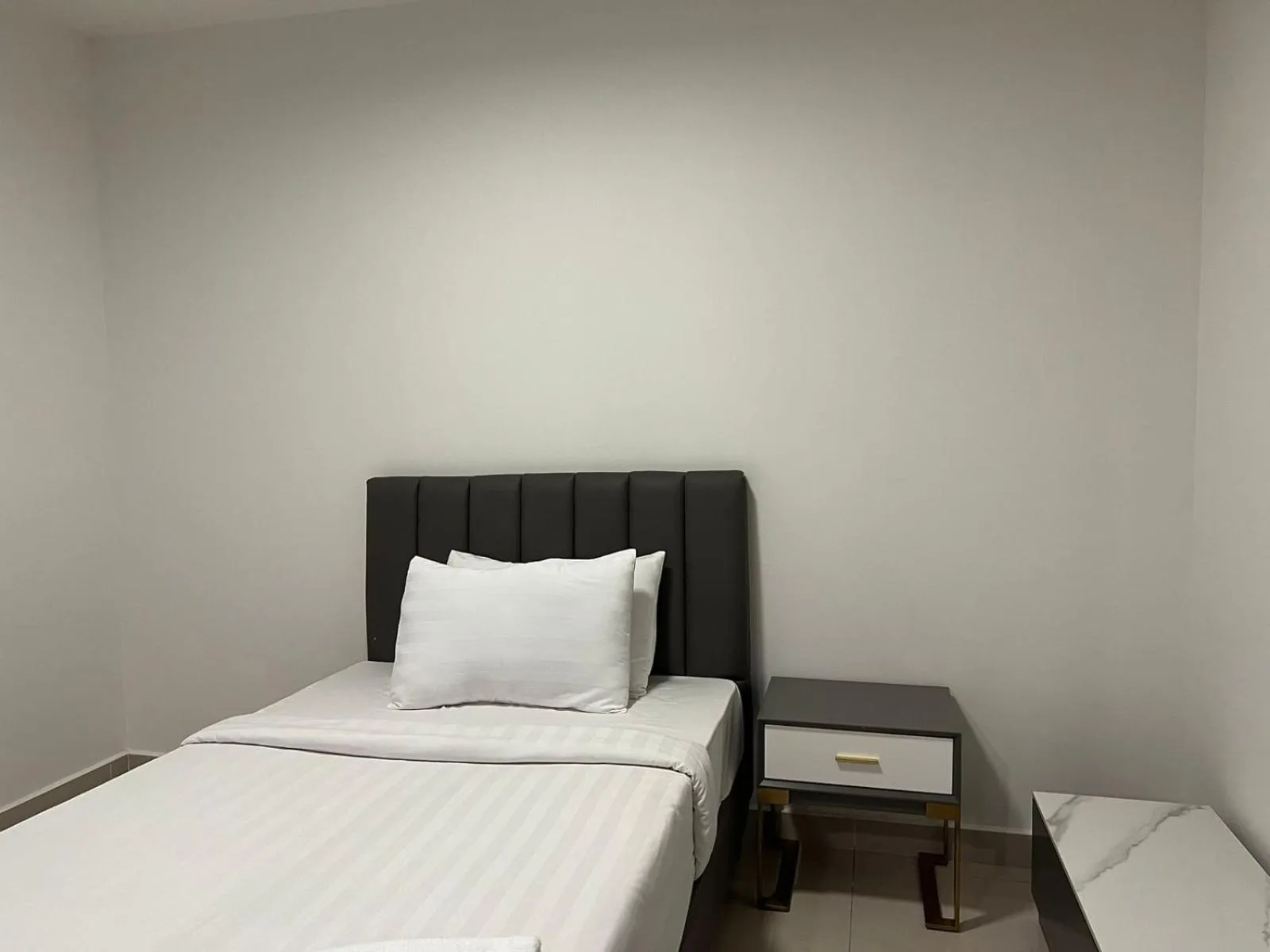 Bed in The PeAk Residence, Multi-Apartment by Emma