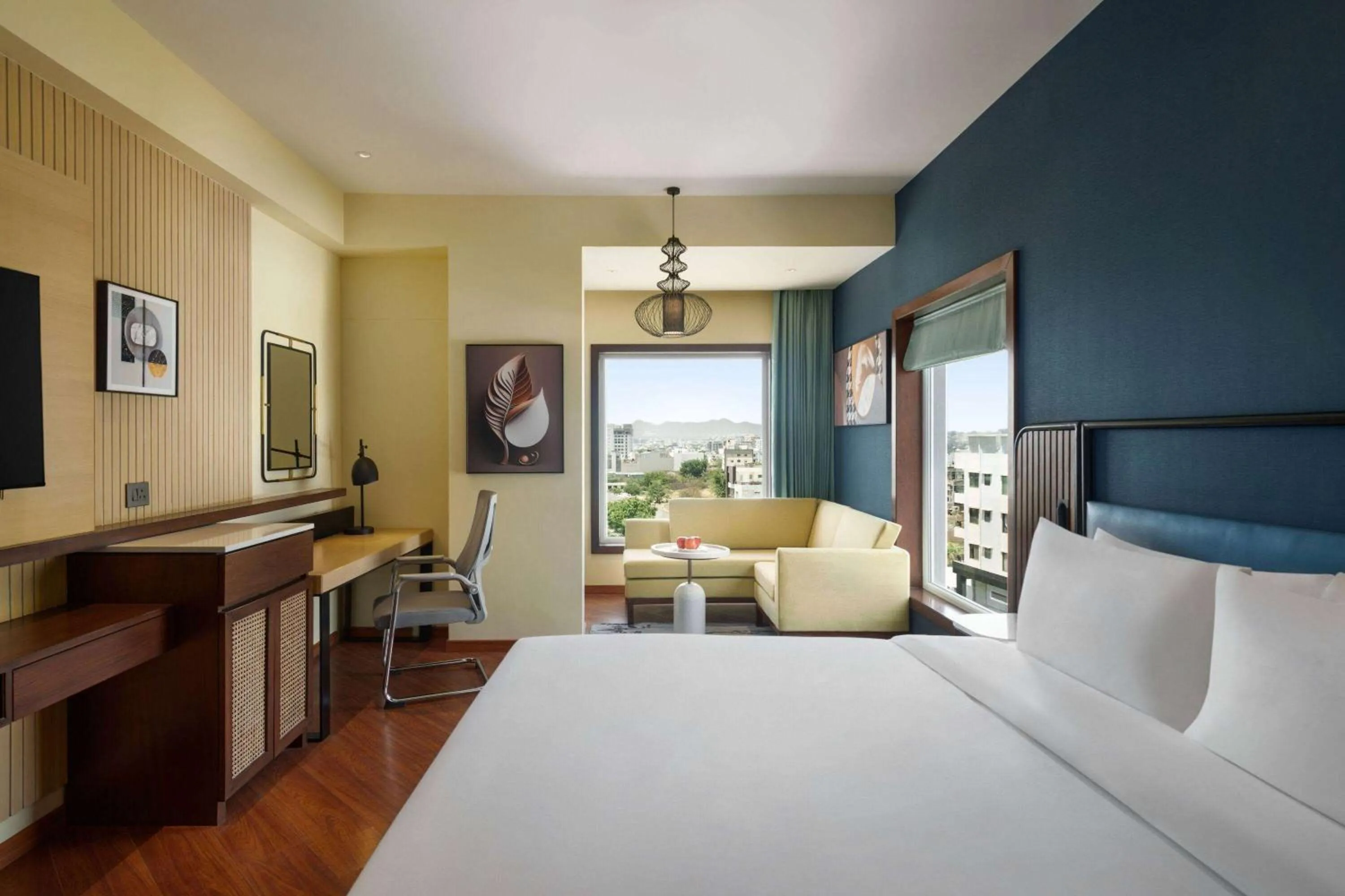 Photo of the whole room, Bed in Ramada Encore by Wyndham Udaipur Roopnagar