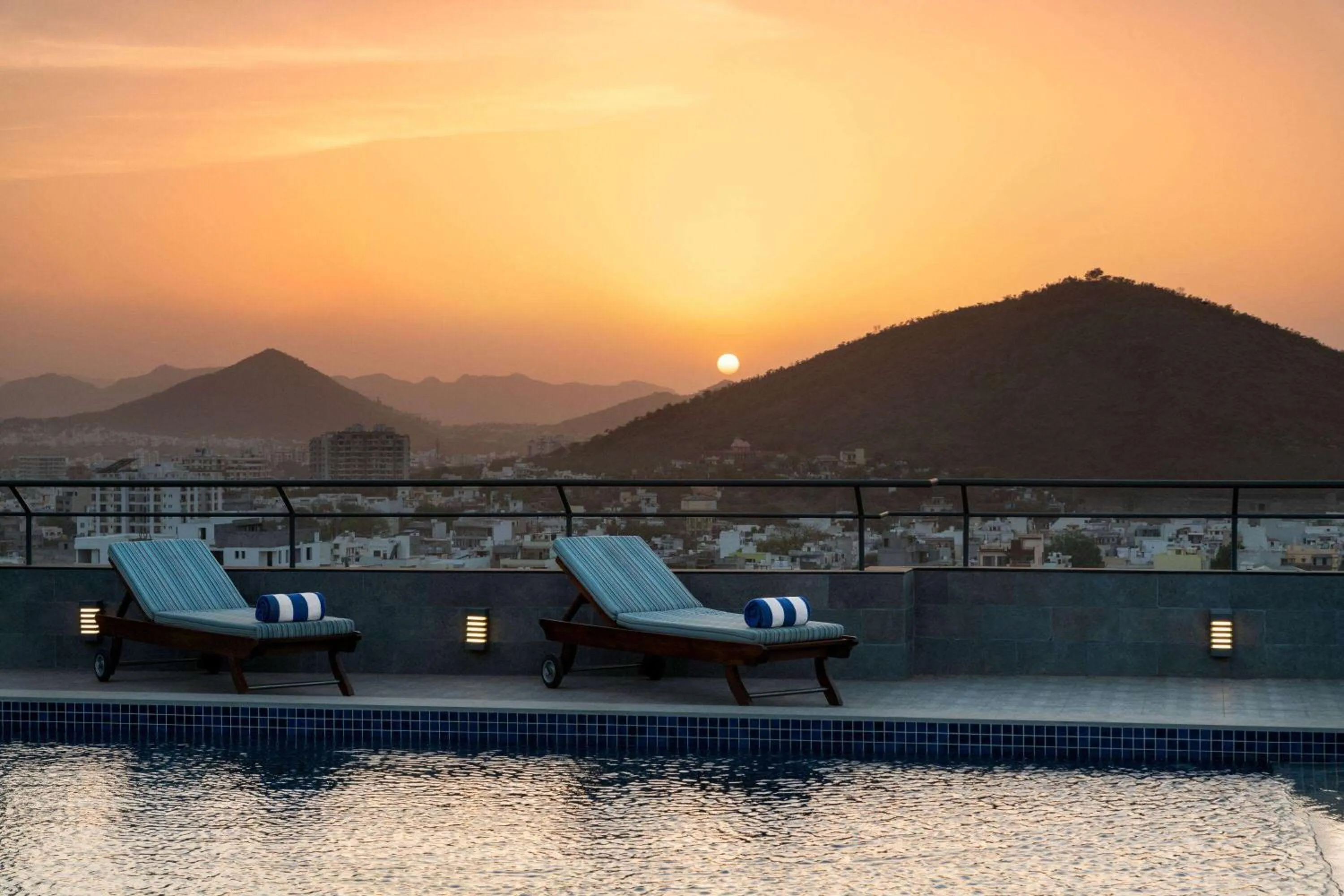 Swimming pool in Ramada Encore by Wyndham Udaipur Roopnagar