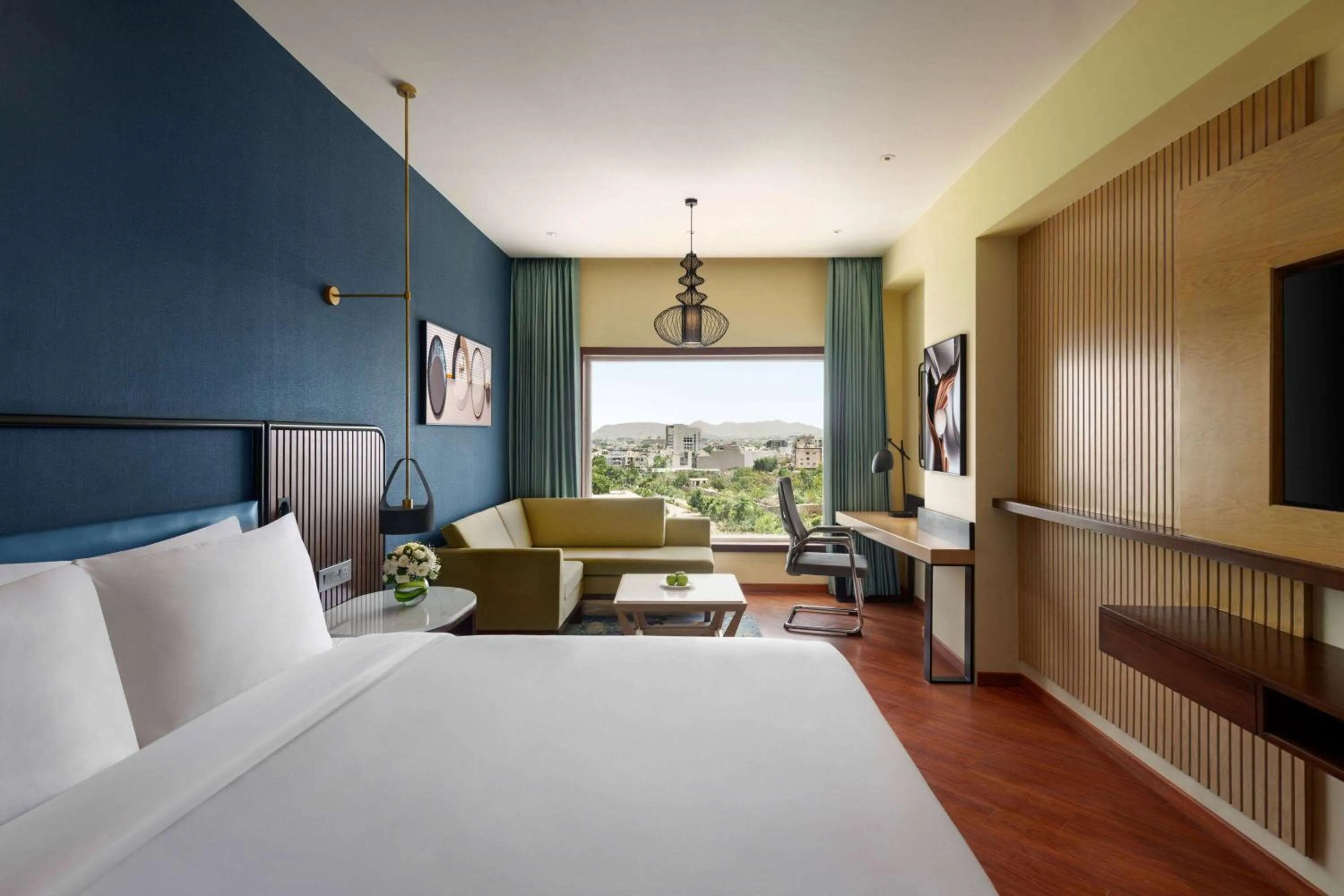 Photo of the whole room, Bed in Ramada Encore by Wyndham Udaipur Roopnagar