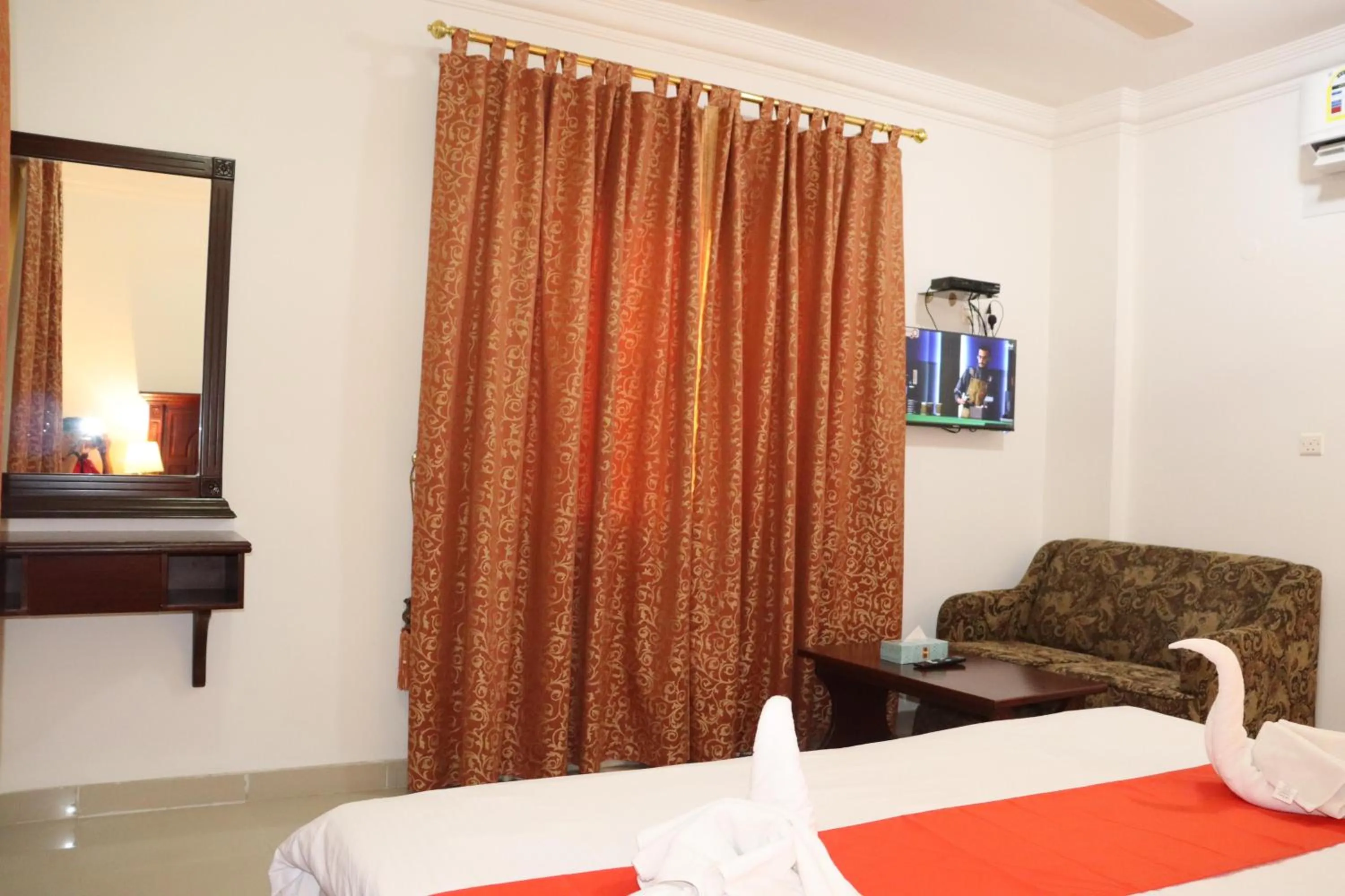 Bed in Dahlia Sohar Hotel Apartments