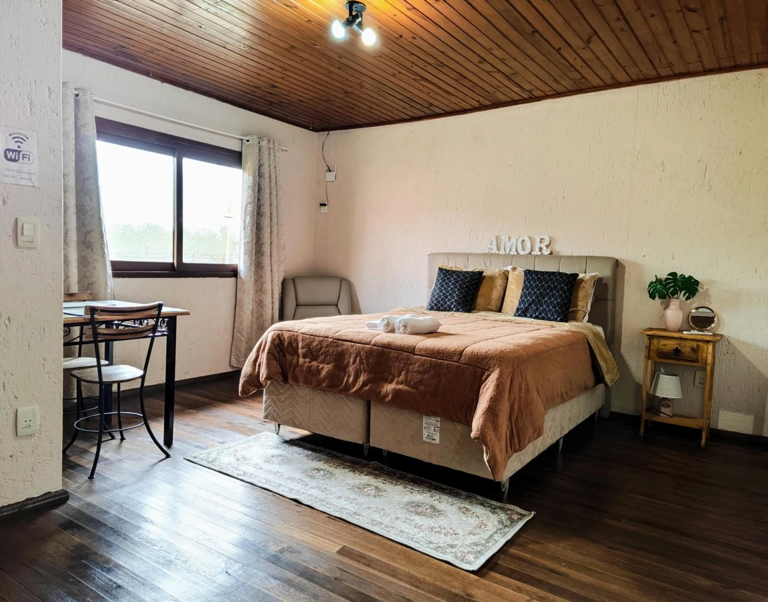 Bed in Chalés Pousada Malacara