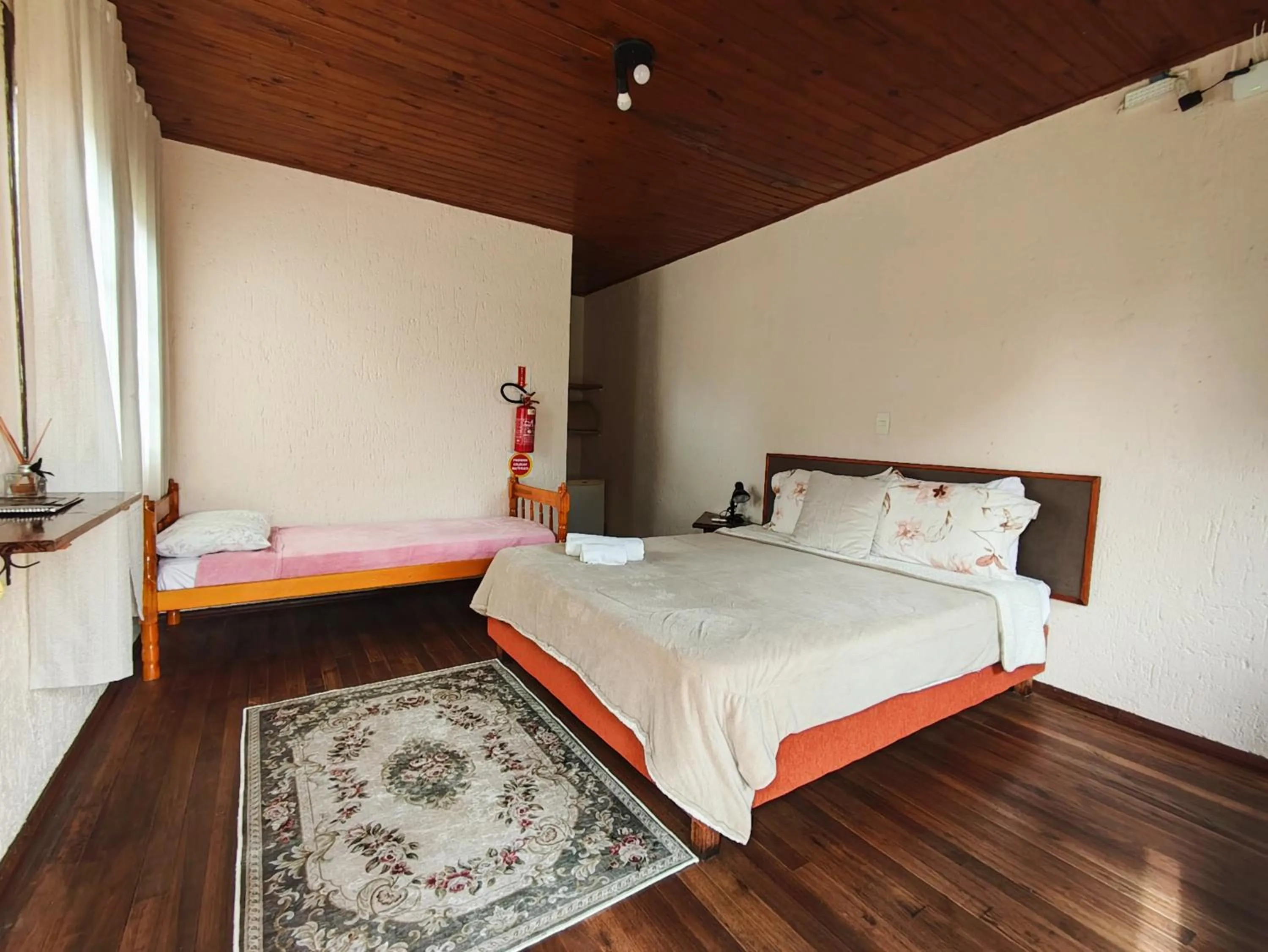 Bed in Chalés Pousada Malacara