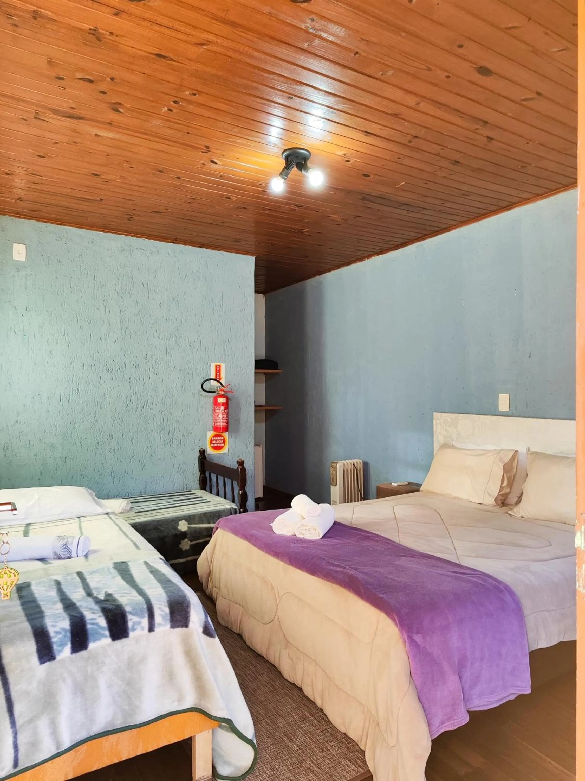 Bed in Chalés Pousada Malacara