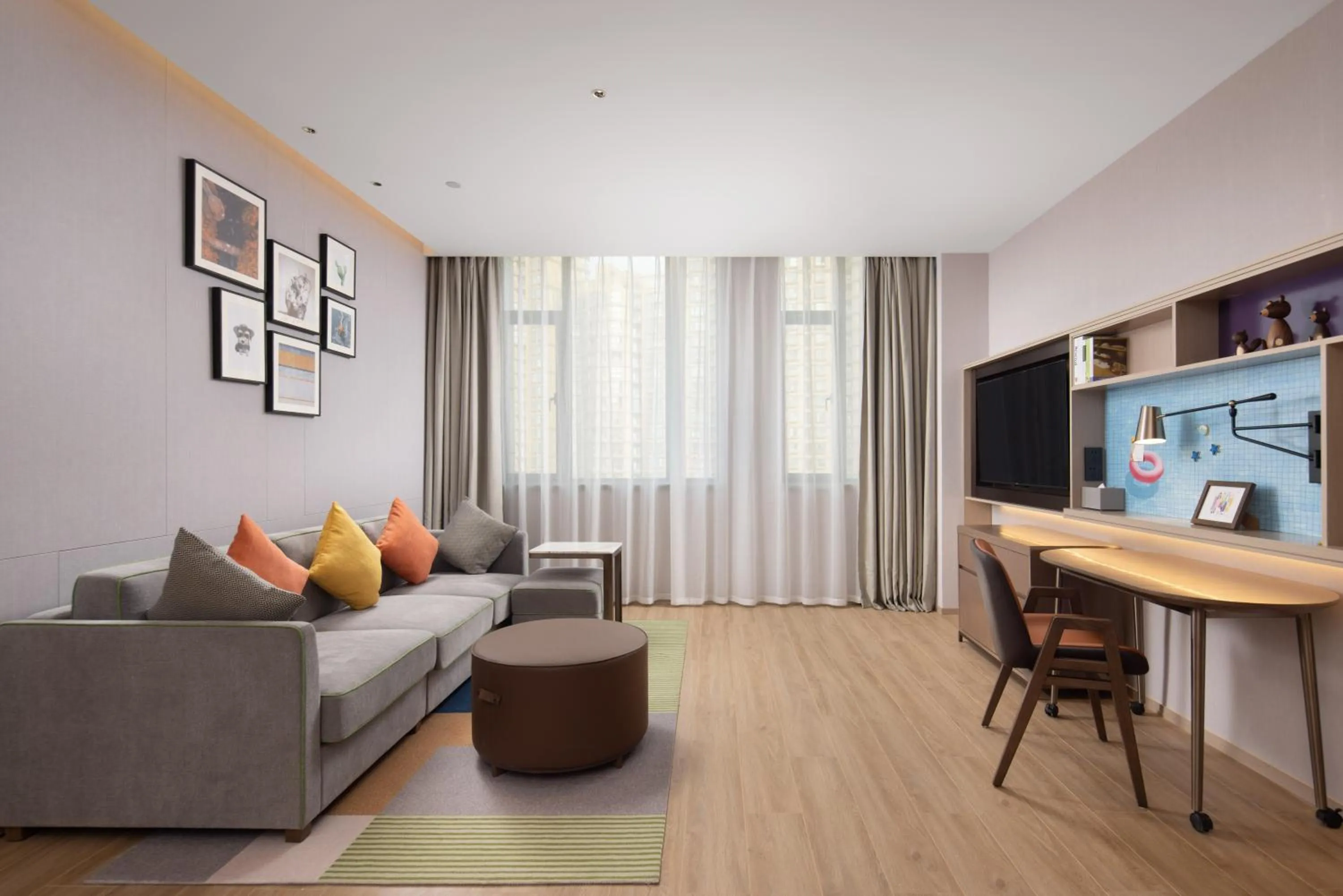 Living room in Home2 Suite by Hilton Hangzhou Qianjiang New Town