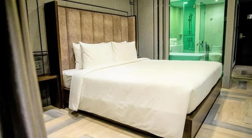 Bed in First Pride Hotel Bangkok