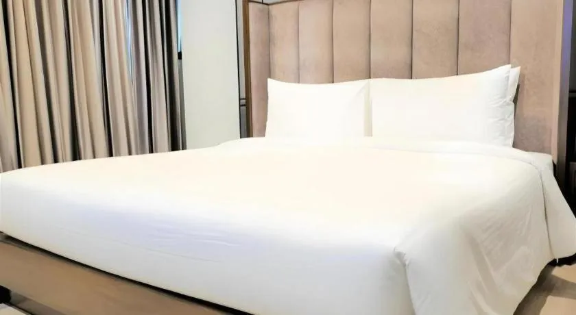 Bed in First Pride Hotel Bangkok