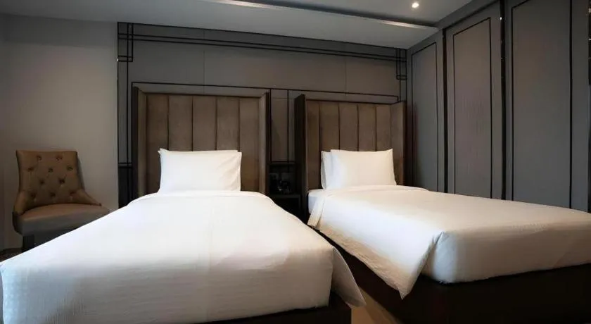 Bed in First Pride Hotel Bangkok