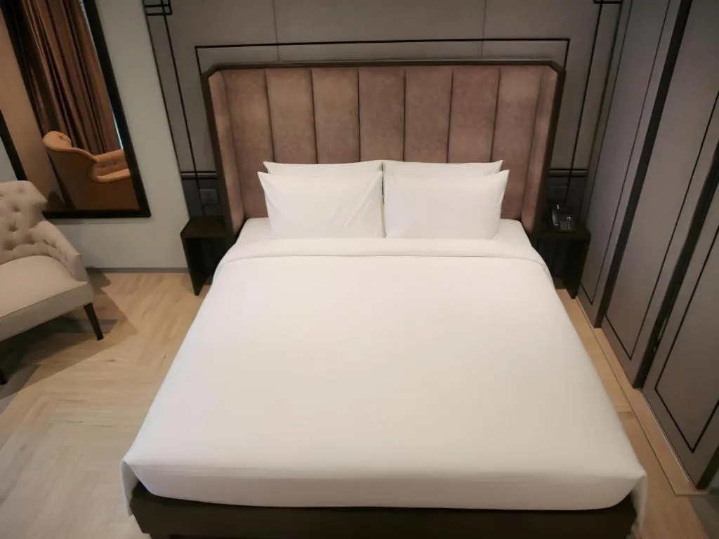 Bed in First Pride Hotel Bangkok