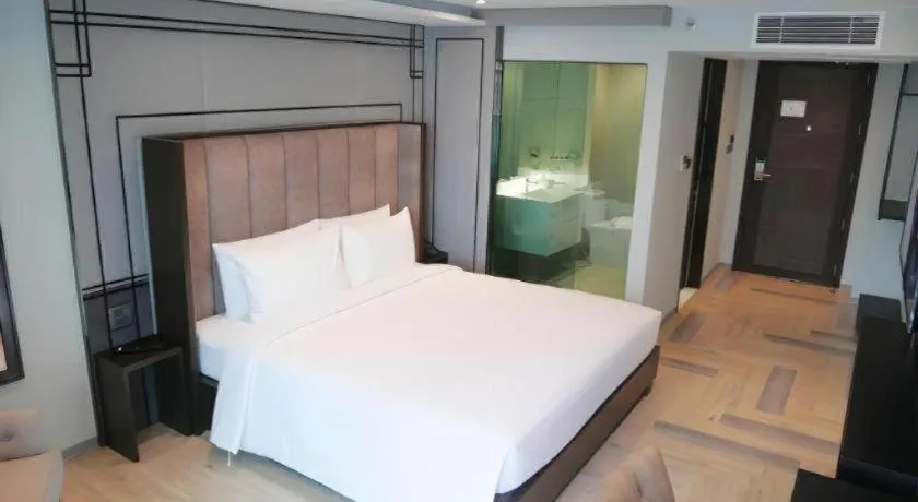 Bed in First Pride Hotel Bangkok