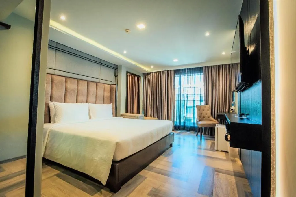 Bed in First Pride Hotel Bangkok