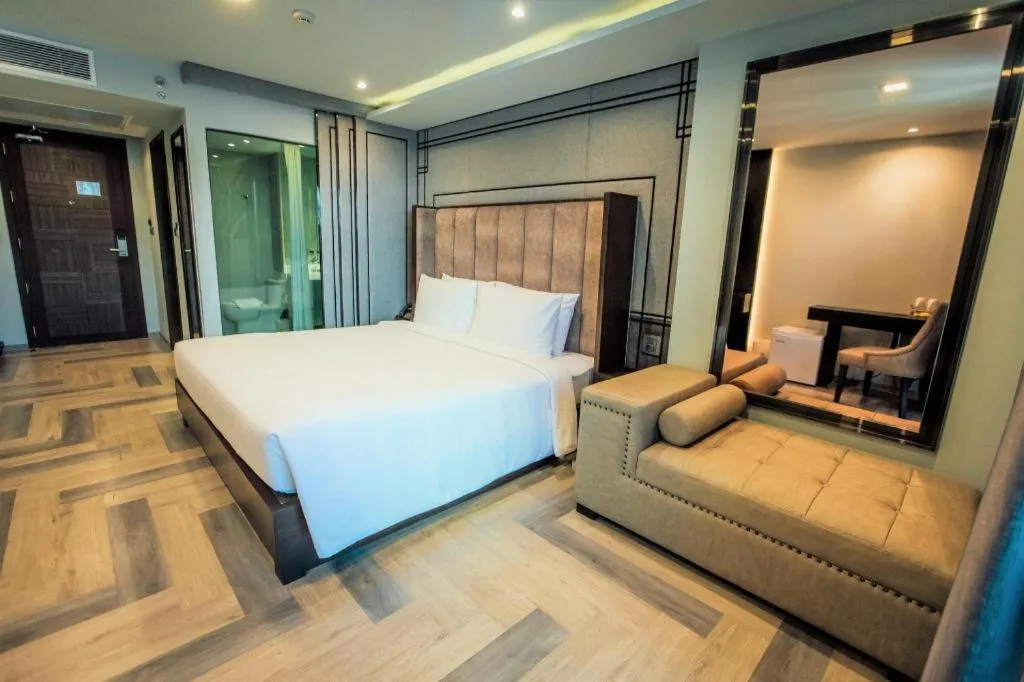 Bed in First Pride Hotel Bangkok