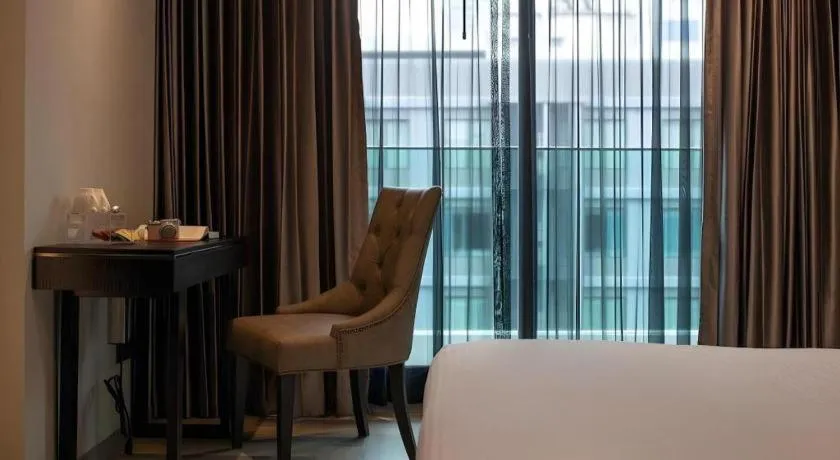 Bed in First Pride Hotel Bangkok