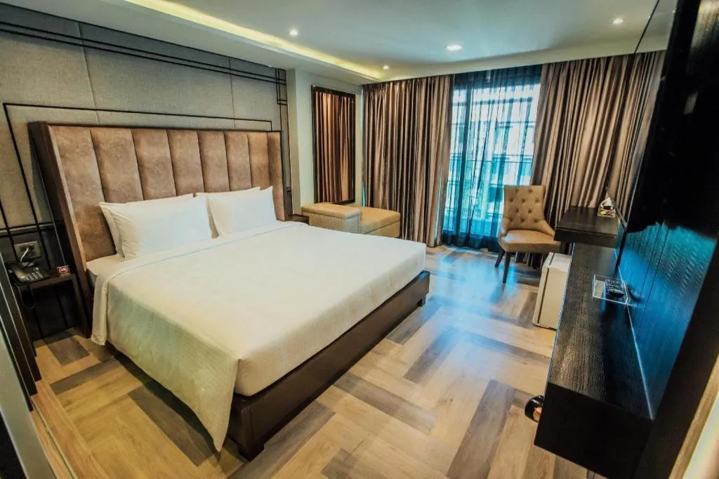 Bed in First Pride Hotel Bangkok