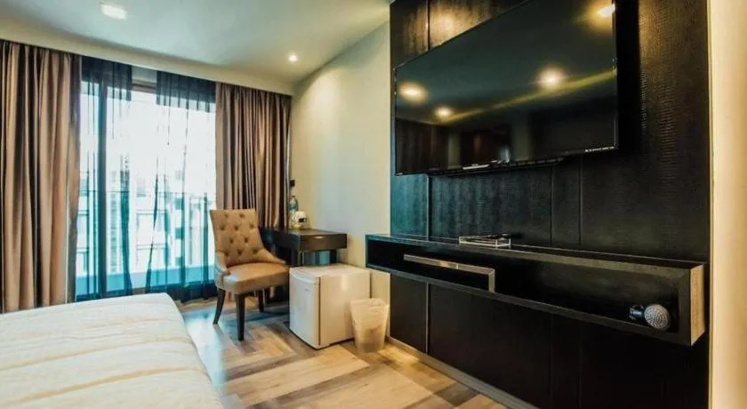 Bed in First Pride Hotel Bangkok