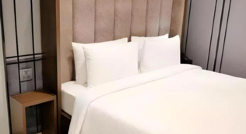 Bed in First Pride Hotel Bangkok