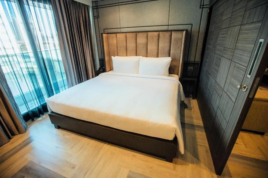 Bed in First Pride Hotel Bangkok