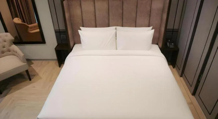 Bed in First Pride Hotel Bangkok