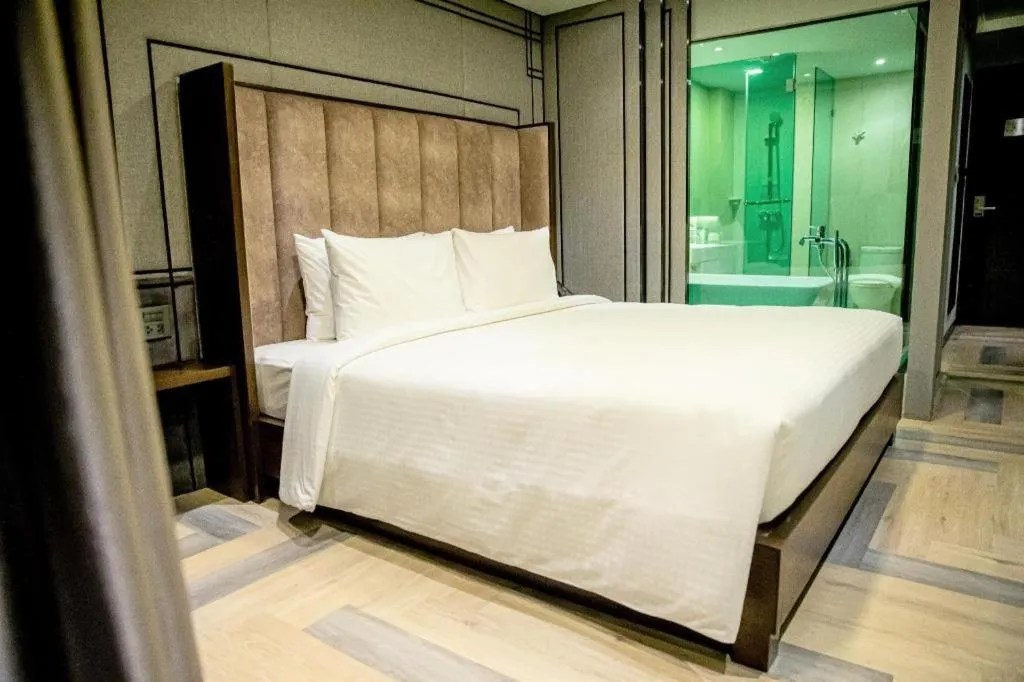 Bed in First Pride Hotel Bangkok