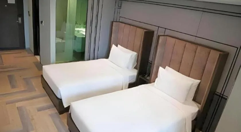 Bed in First Pride Hotel Bangkok