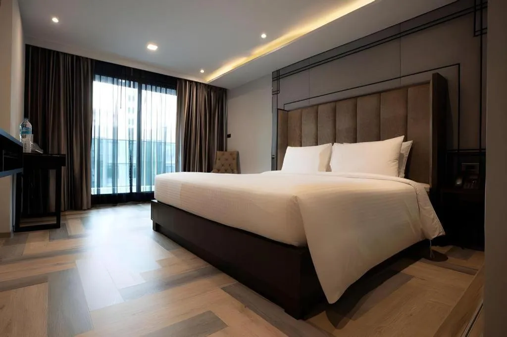 Bed in First Pride Hotel Bangkok