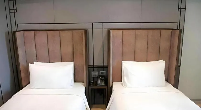 Bed in First Pride Hotel Bangkok