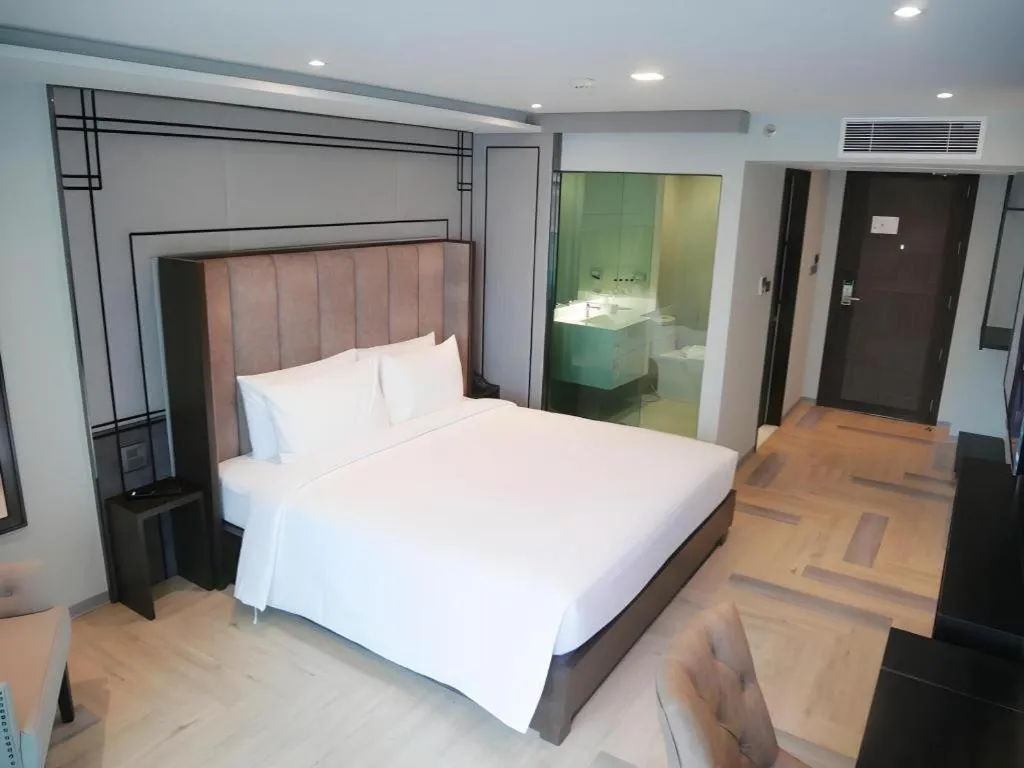 Bed in First Pride Hotel Bangkok