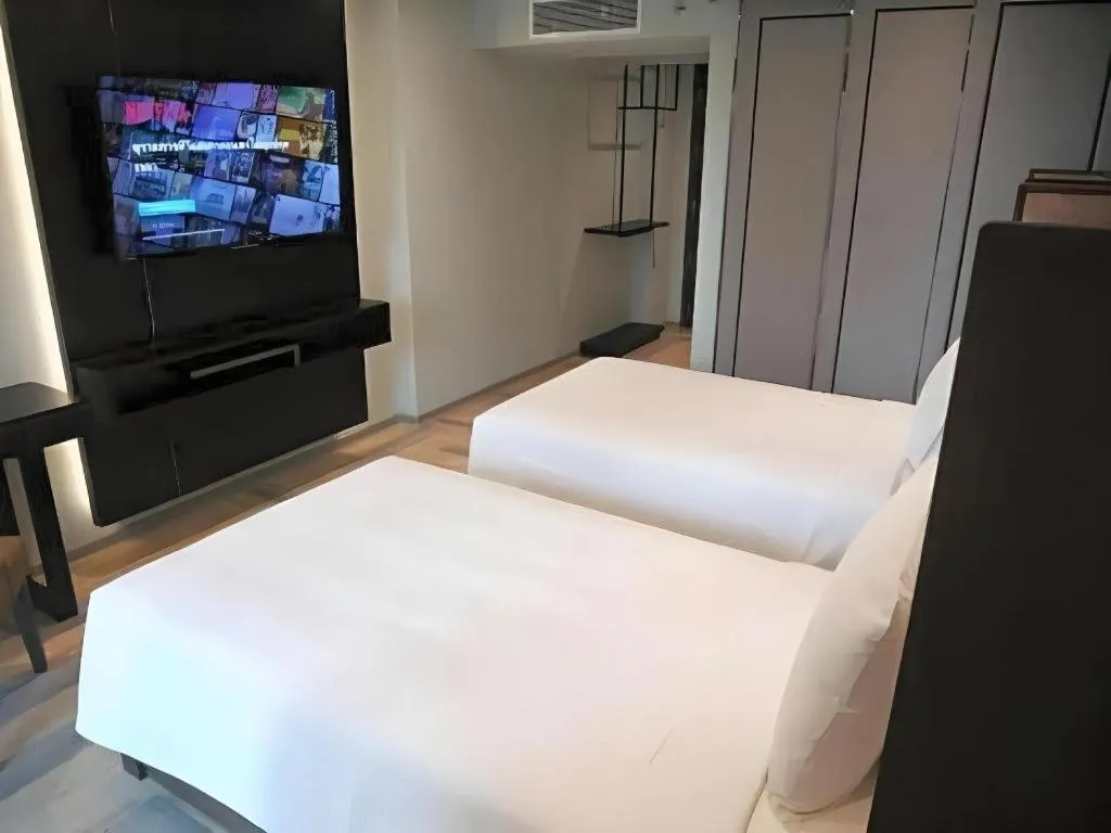 Bed in First Pride Hotel Bangkok