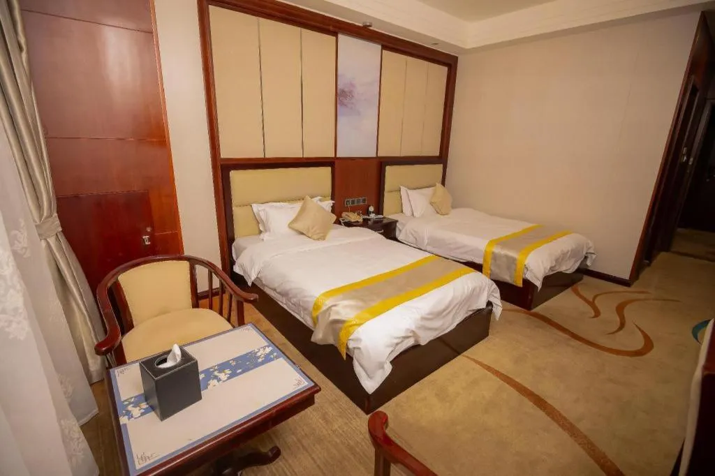 Bed in Grand Szechuan Hotel Vientiane