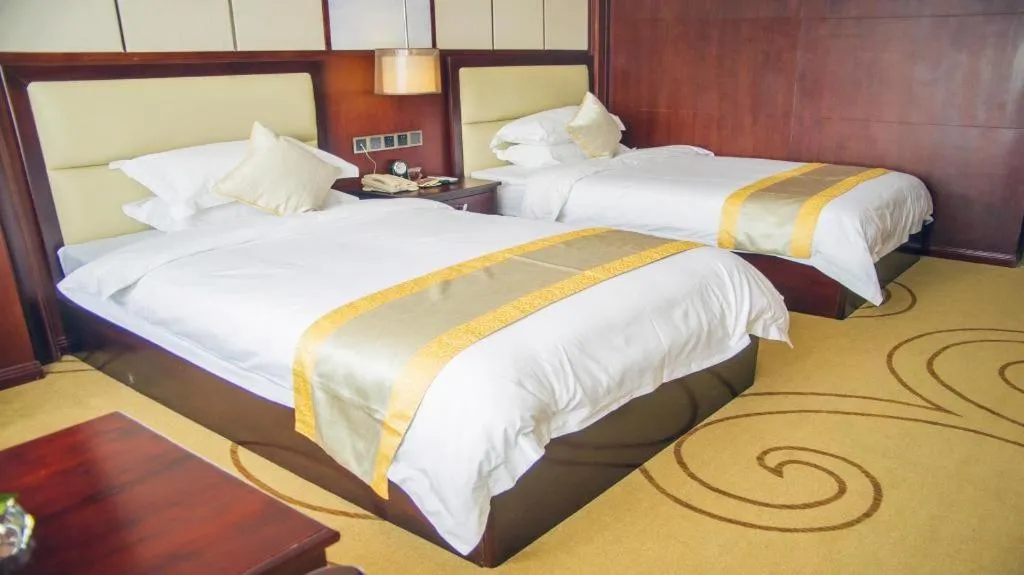 Bed in Grand Szechuan Hotel Vientiane