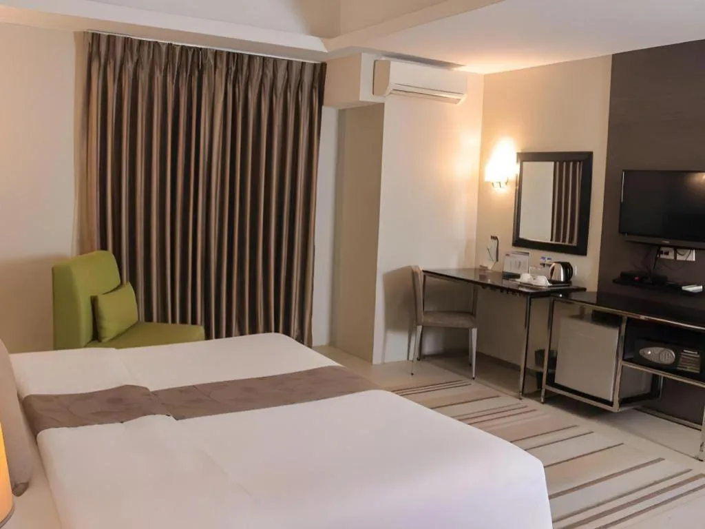 Bed in Sequoia Hotel Quezon City