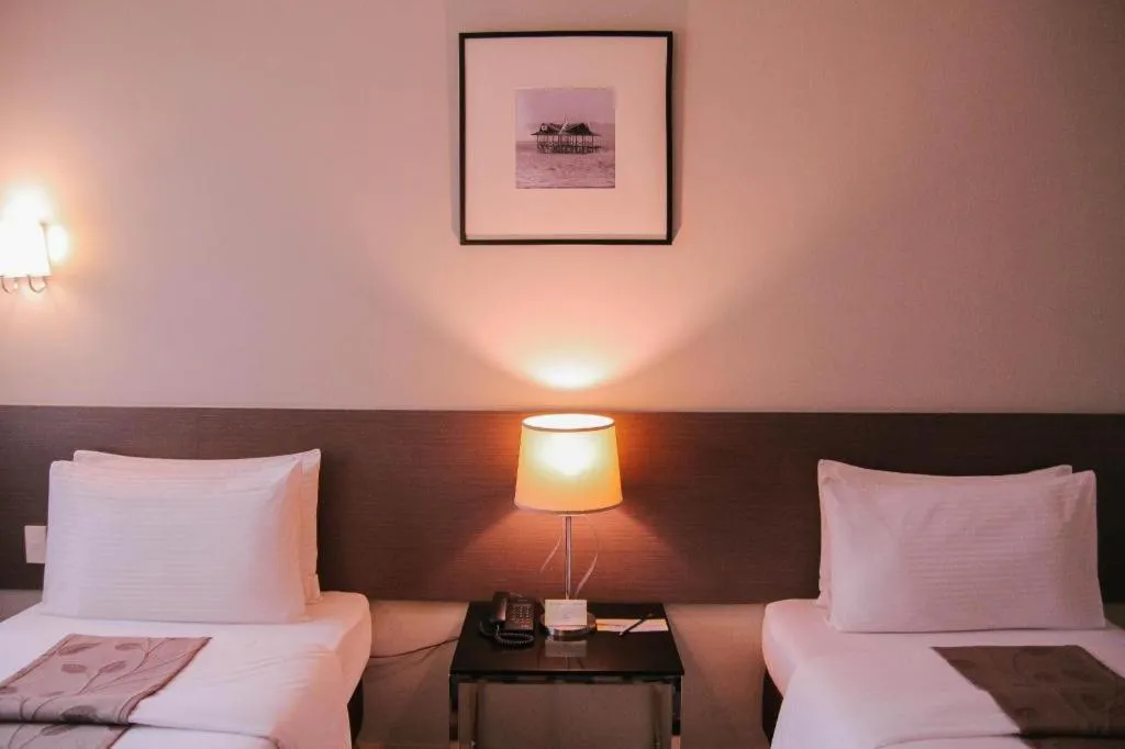 Bed in Sequoia Hotel Quezon City