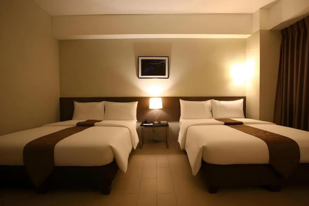 Bed in Sequoia Hotel Quezon City