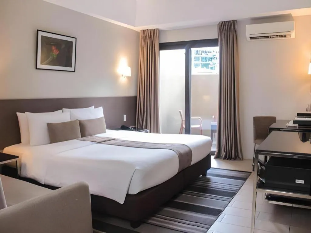 Bed in Sequoia Hotel Quezon City