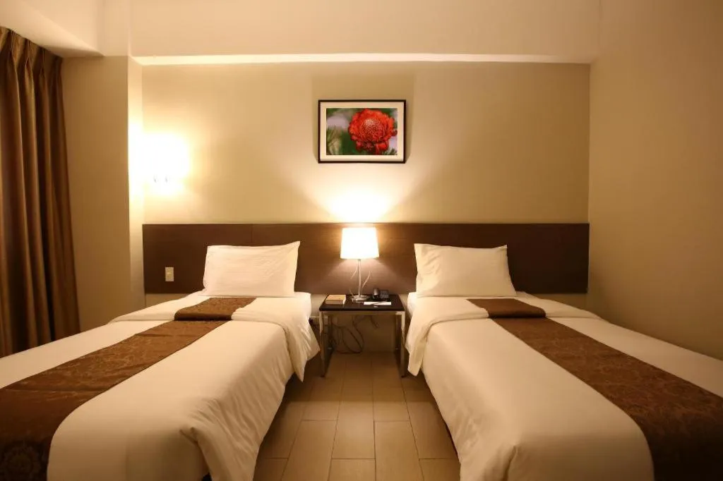 Bed in Sequoia Hotel Quezon City