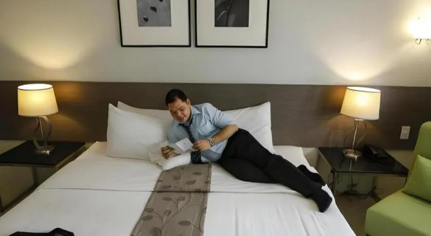 Bed in Sequoia Hotel Quezon City