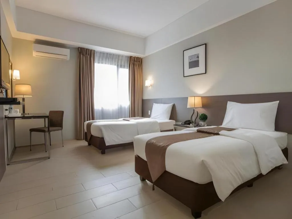 Bed in Sequoia Hotel Quezon City