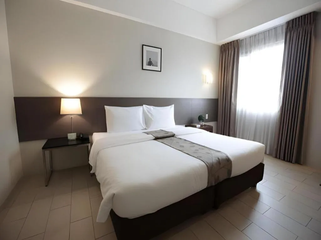 Bed in Sequoia Hotel Quezon City