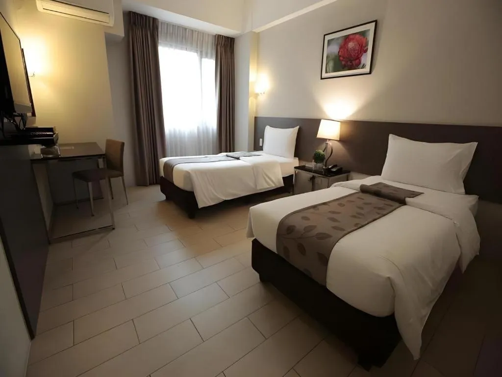 Bed in Sequoia Hotel Quezon City