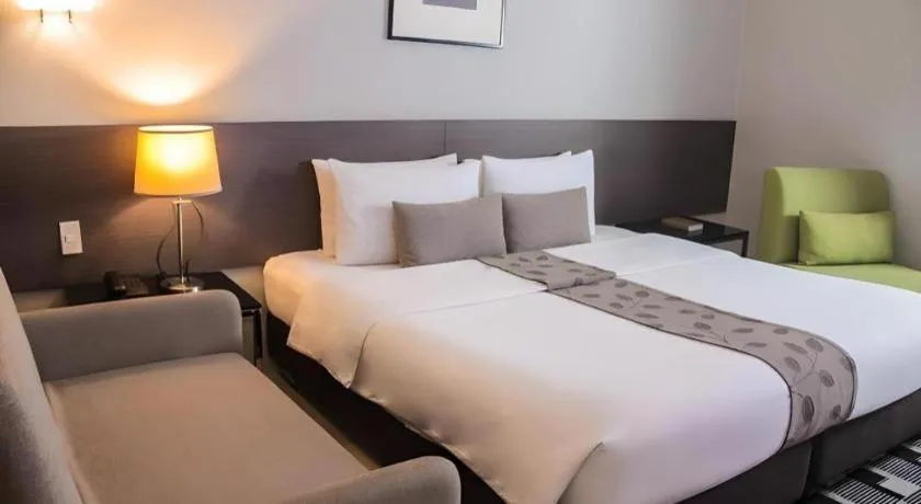 Bed in Sequoia Hotel Quezon City