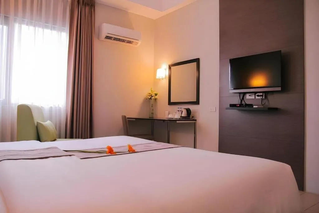 Bed in Sequoia Hotel Quezon City