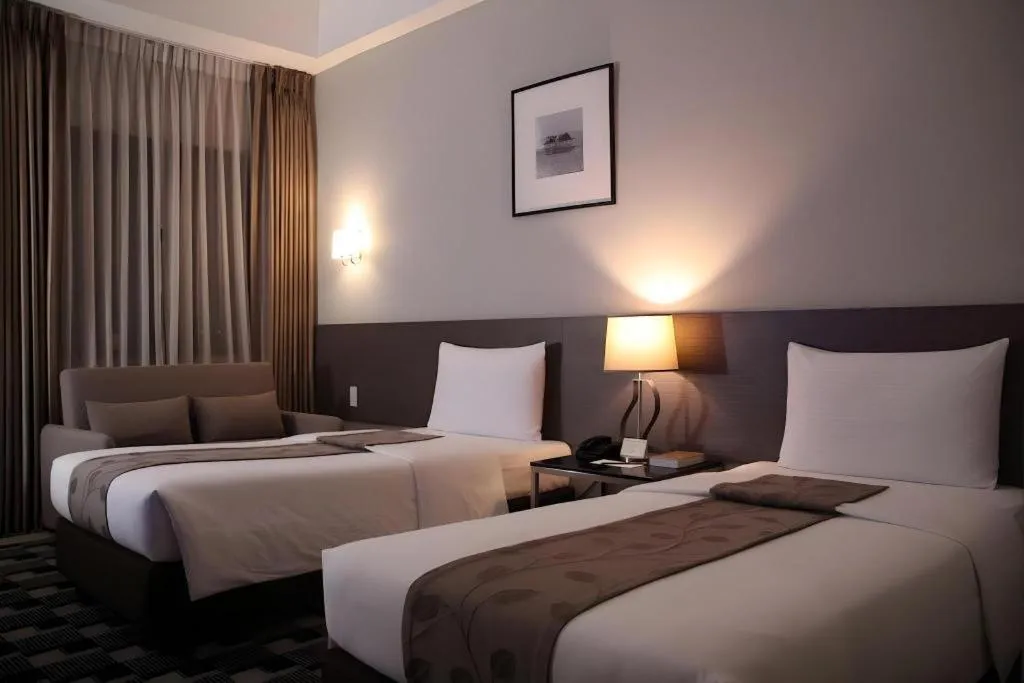 Bed in Sequoia Hotel Quezon City