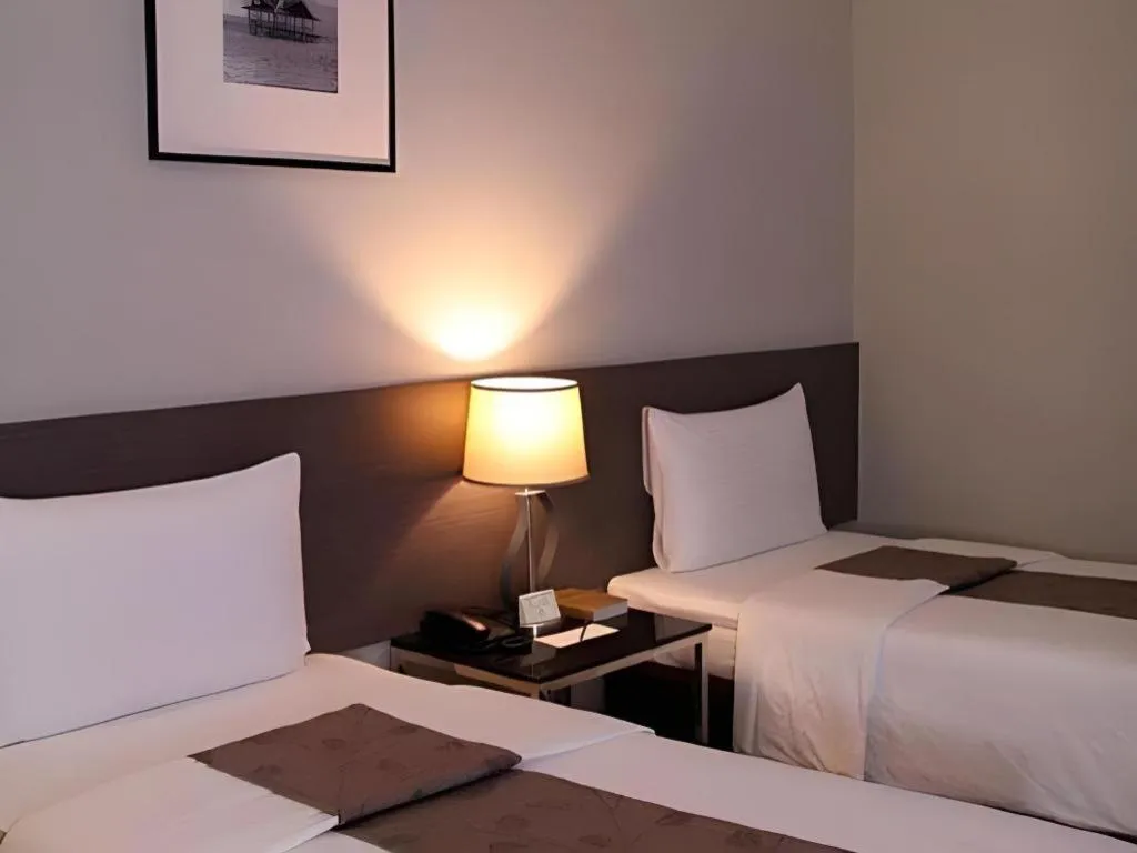 Bed in Sequoia Hotel Quezon City