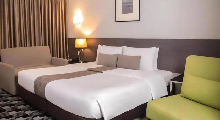 Bed in Sequoia Hotel Quezon City