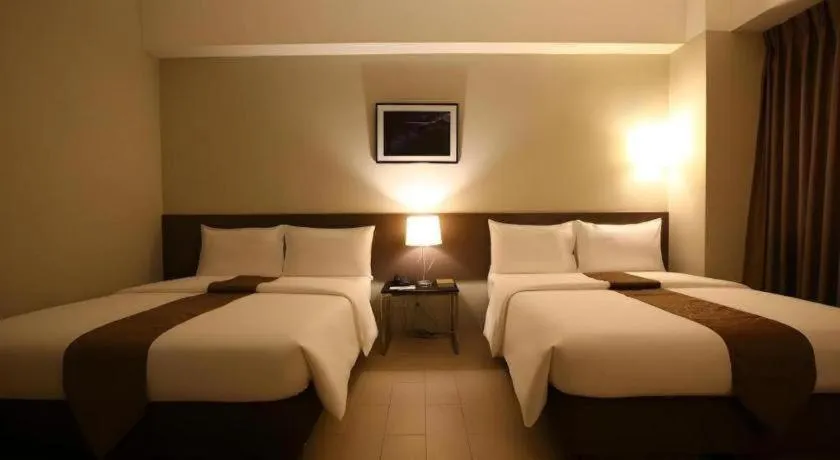 Bed in Sequoia Hotel Quezon City